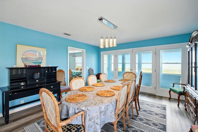 7029 N Ocean Shore Blvd, Palm Coast, FL 32137 - dining area featuring french doors and wood finished floors