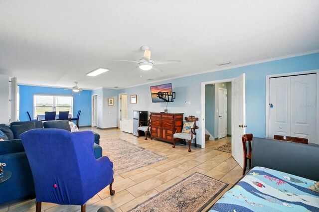 7029 N Ocean Shore Blvd, Palm Coast, FL 32137 - living area with a ceiling fan, ornamental molding, and baseboards