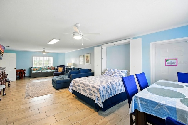 7029 N Ocean Shore Blvd, Palm Coast, FL 32137 - bedroom featuring crown molding, light wood-style floors, and a ceiling fan