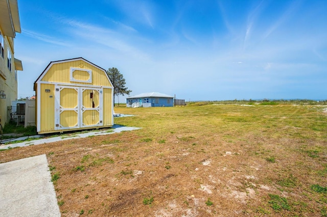 7029 N Ocean Shore Blvd, Palm Coast, FL 32137 - view of green lawn featuring a storage shed and an outbuilding