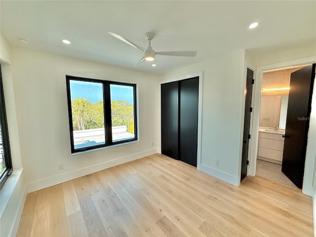 807 N Flagler Ave, Flagler Beach, FL 32136 - unfurnished bedroom with light wood-type flooring, recessed lighting, baseboards, and a closet