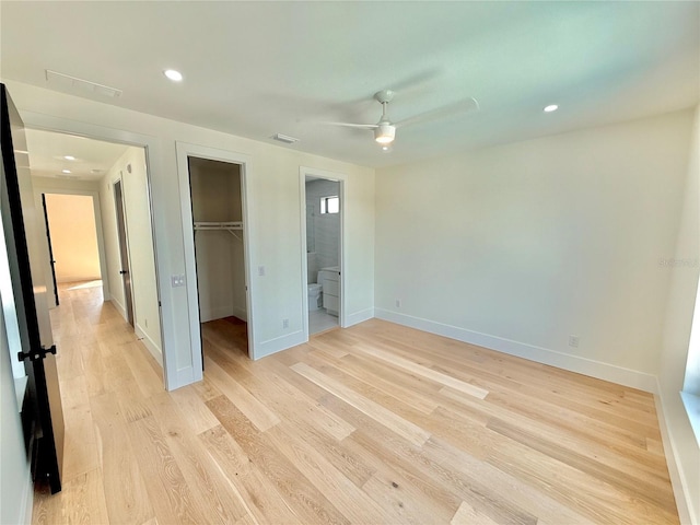 807 N Flagler Ave, Flagler Beach, FL 32136 - unfurnished bedroom featuring a spacious closet, baseboards, light wood finished floors, a closet, and recessed lighting