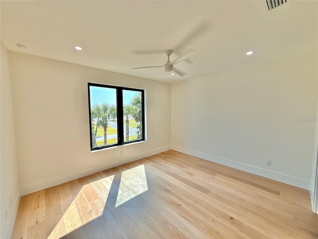 807 N Flagler Ave, Flagler Beach, FL 32136 - spare room with a ceiling fan, baseboards, light wood-type flooring, recessed lighting, and a smoke detector