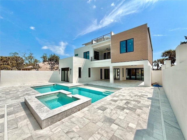 807 N Flagler Ave, Flagler Beach, FL 32136 - view of swimming pool featuring ceiling fan, a patio, a fenced backyard, and a pool with connected hot tub