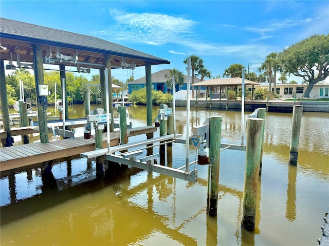 807 N Flagler Ave, Flagler Beach, FL 32136 - dock featuring boat lift and a water view