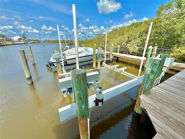 807 N Flagler Ave, Flagler Beach, FL 32136 - dock featuring boat lift and a water view