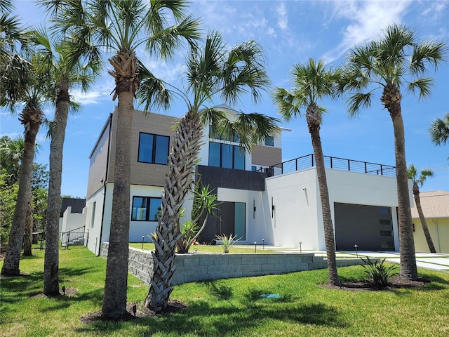 807 N Flagler Ave, Flagler Beach, FL 32136 - view of building exterior with an attached garage and driveway