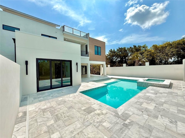 807 N Flagler Ave, Flagler Beach, FL 32136 - view of swimming pool featuring a patio area, a pool with connected hot tub, and fence