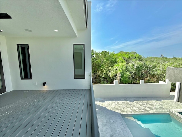 807 N Flagler Ave, Flagler Beach, FL 32136 - wooden deck featuring an outdoor pool