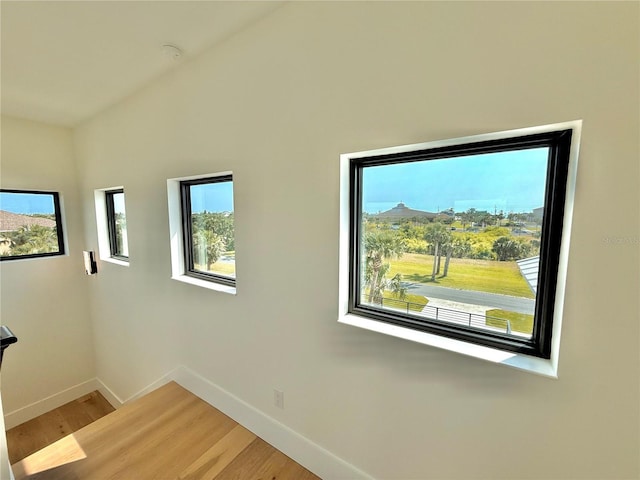 807 N Flagler Ave, Flagler Beach, FL 32136 - spare room featuring baseboards, light wood finished floors, plenty of natural light, and a smoke detector