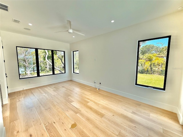 807 N Flagler Ave, Flagler Beach, FL 32136 - unfurnished room with baseboards, ceiling fan, light wood-style floors, healthy amount of natural light, and recessed lighting
