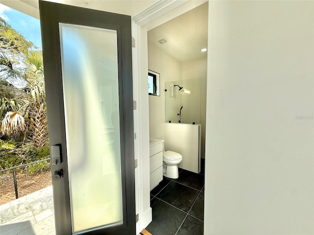807 N Flagler Ave, Flagler Beach, FL 32136 - full bathroom with toilet, tile patterned floors, a shower, and vanity