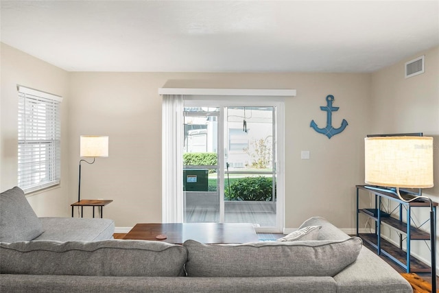 living room featuring wood finished floors and baseboards