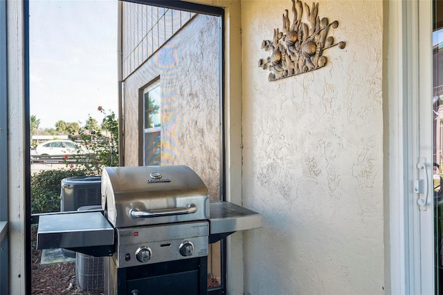 exterior view of stucco siding and central air condition unit