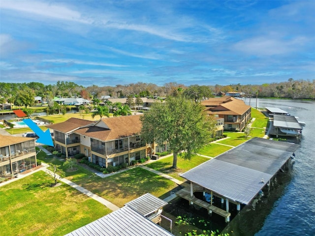 aerial view of residential area with a nearby body of water