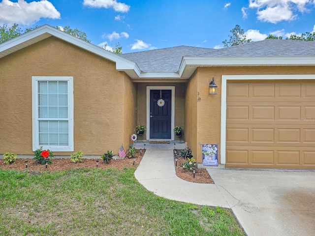 7 Bunker View Dr, Palm Coast, FL 32137 - property entrance with stucco siding, a garage, and roof with shingles