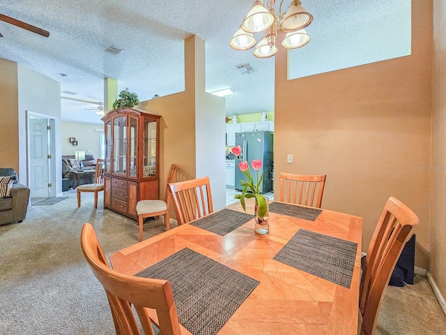 7 Bunker View Dr, Palm Coast, FL 32137 - dining area with ceiling fan, a chandelier, and carpet flooring