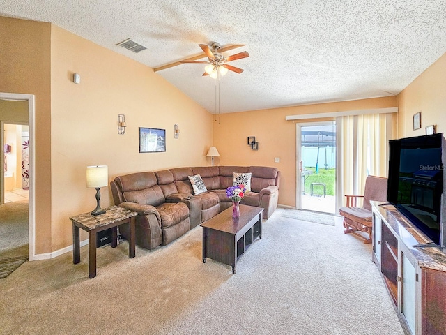 7 Bunker View Dr, Palm Coast, FL 32137 - carpeted living room with ceiling fan, lofted ceiling, and a textured ceiling