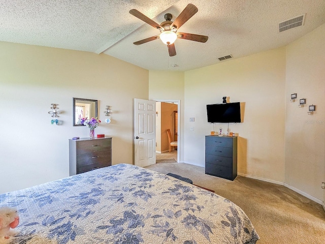 7 Bunker View Dr, Palm Coast, FL 32137 - bedroom with carpet floors, vaulted ceiling, baseboards, ceiling fan, and a textured ceiling