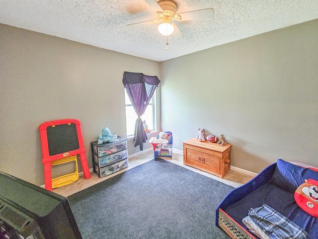 7 Bunker View Dr, Palm Coast, FL 32137 - game room featuring a ceiling fan, carpet flooring, a textured ceiling, and baseboards