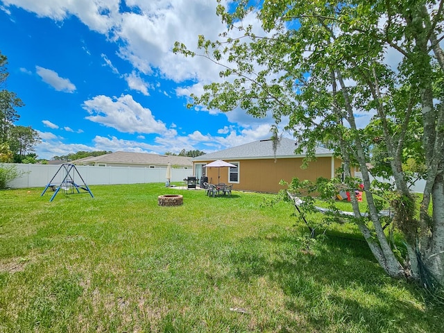 7 Bunker View Dr, Palm Coast, FL 32137 - view of yard with a fire pit