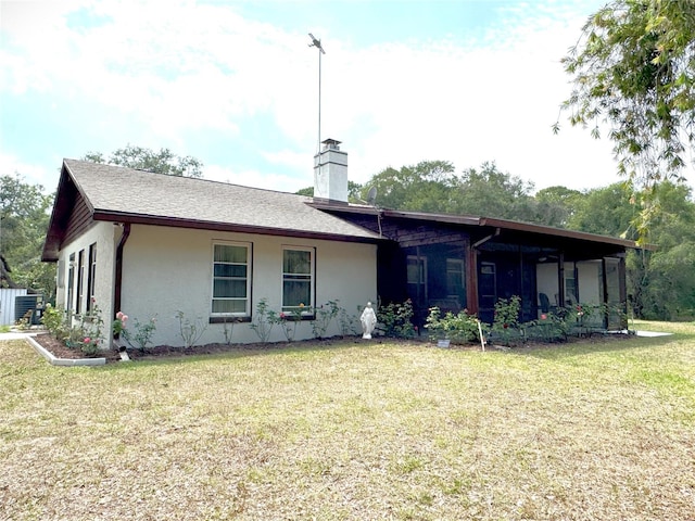 486 S US Highway 1, Oak Hill, FL 32759 - view of front of property with a chimney, a front lawn, and stucco siding