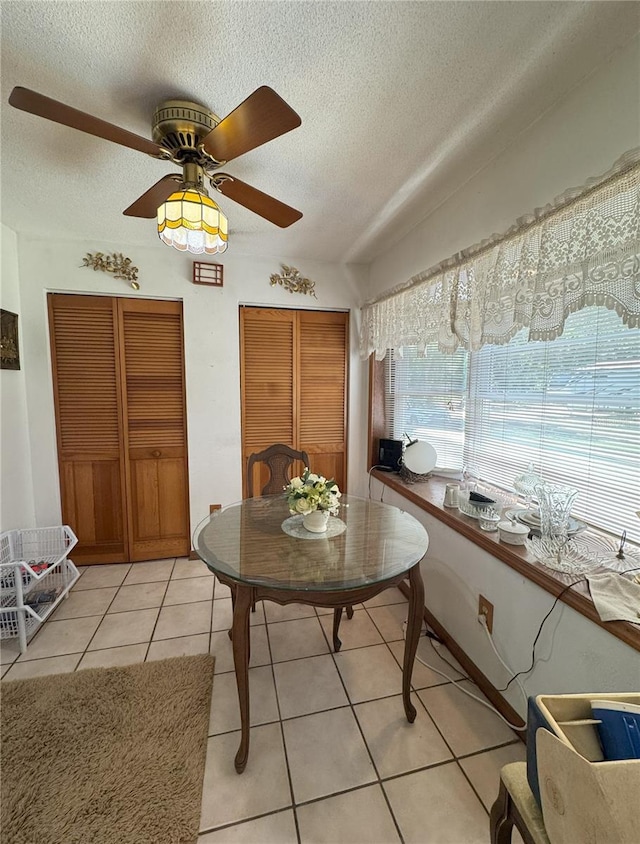 486 S US Highway 1, Oak Hill, FL 32759 - dining space featuring a textured ceiling, light tile patterned flooring, and ceiling fan