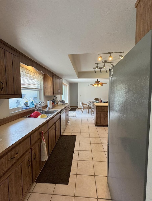 486 S US Highway 1, Oak Hill, FL 32759 - kitchen featuring appliances with stainless steel finishes, a sink, light tile patterned flooring, a ceiling fan, and light countertops