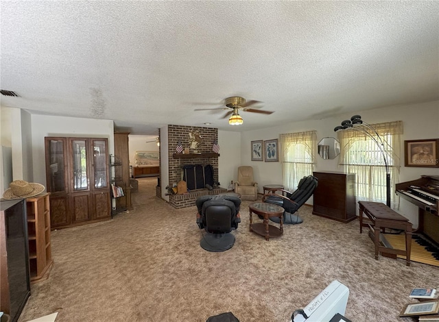 486 S US Highway 1, Oak Hill, FL 32759 - living area featuring a ceiling fan, a textured ceiling, carpet flooring, and a fireplace