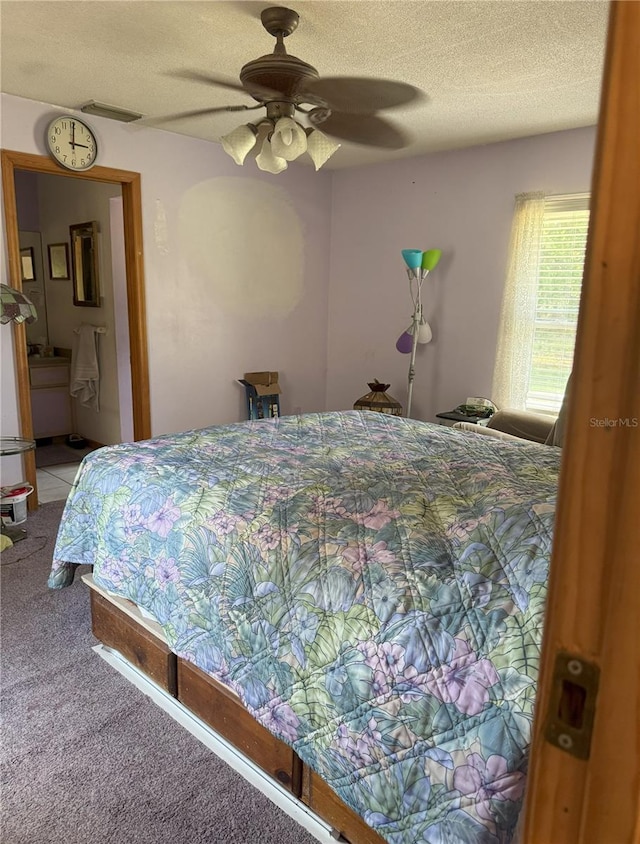 486 S US Highway 1, Oak Hill, FL 32759 - bedroom featuring light carpet, a textured ceiling, and ceiling fan