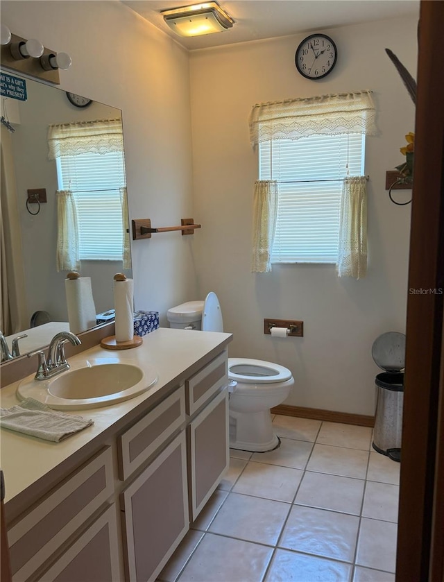 486 S US Highway 1, Oak Hill, FL 32759 - bathroom with vanity, toilet, and tile patterned floors