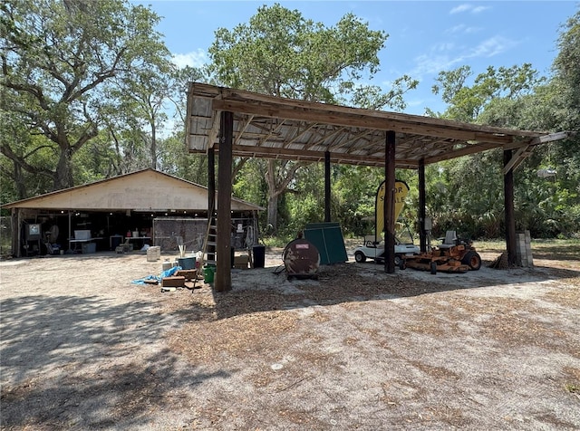 486 S US Highway 1, Oak Hill, FL 32759 - view of home's community featuring a pole building, an outdoor structure, and a carport
