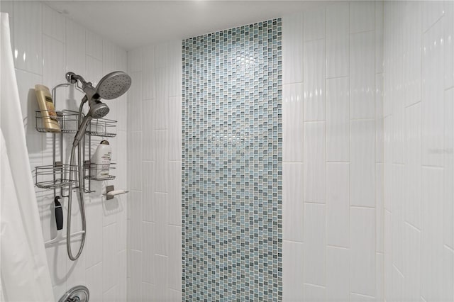 full bath featuring a tile shower