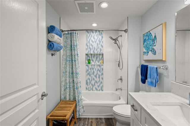 bathroom with recessed lighting, wood finished floors, shower / tub combo with curtain, toilet, and vanity