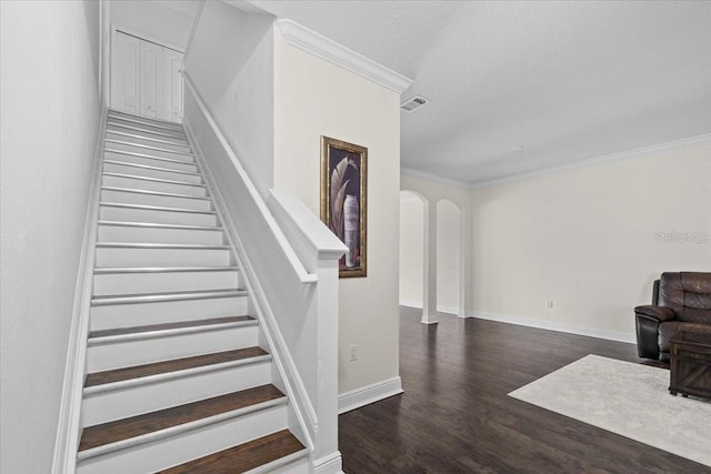 70 Riverview Bnd S Unit 715, Palm Coast, FL 32137 - stairway with arched walkways, ornamental molding, wood finished floors, and baseboards