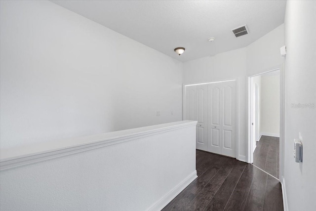 70 Riverview Bnd S Unit 715, Palm Coast, FL 32137 - hallway featuring dark wood-style floors and baseboards