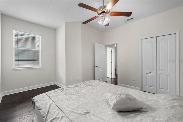 70 Riverview Bnd S Unit 715, Palm Coast, FL 32137 - bedroom with baseboards, wood finished floors, a closet, a ceiling fan, and lofted ceiling