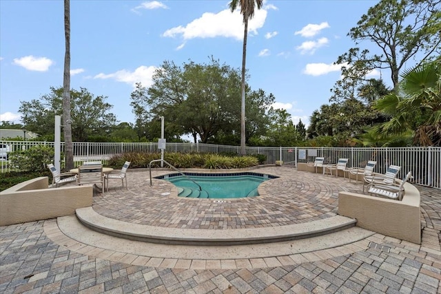 70 Riverview Bnd S Unit 715, Palm Coast, FL 32137 - view of pool featuring fence, a patio area, and a community hot tub