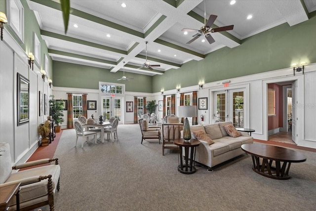 70 Riverview Bnd S Unit 715, Palm Coast, FL 32137 - carpeted living area featuring a towering ceiling, french doors, ceiling fan, coffered ceiling, and beam ceiling