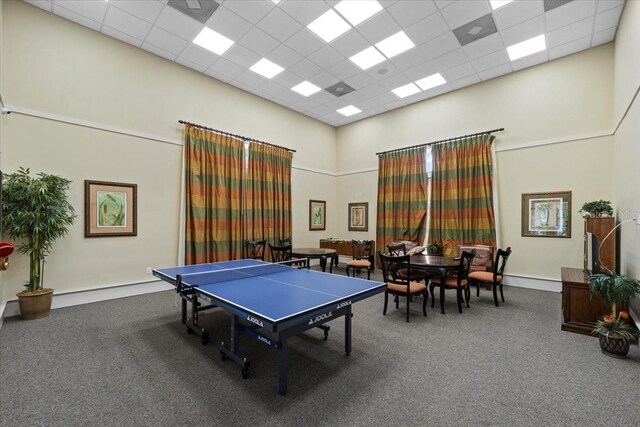 70 Riverview Bnd S Unit 715, Palm Coast, FL 32137 - playroom with a towering ceiling, carpet floors, and a drop ceiling