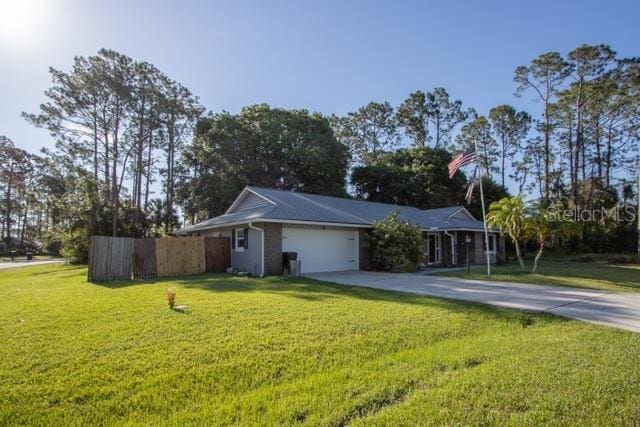 view of home's exterior featuring concrete driveway and a garage