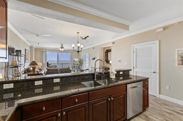kitchen with a sink, ornamental molding, stainless steel dishwasher, light wood-style floors, and baseboards