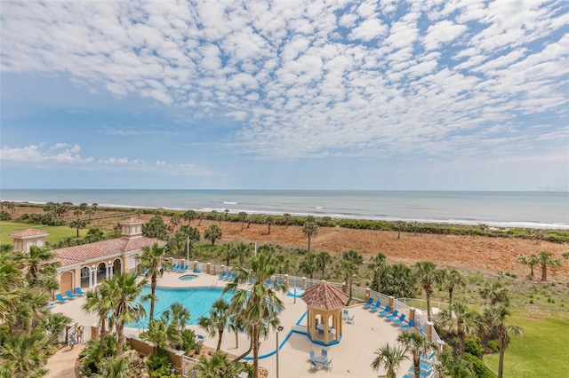 aerial view of expansive beach and a pool area