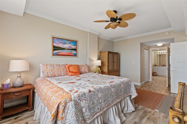 bedroom with light wood-style floors, crown molding, baseboards, connected bathroom, and ceiling fan