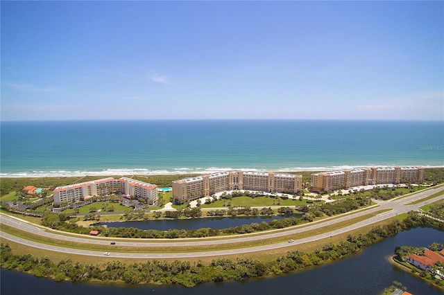 aerial view of a nearby body of water and apartment complex