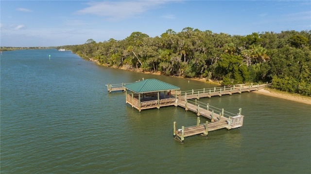 dock area with a water view, a gazebo, and a forest view