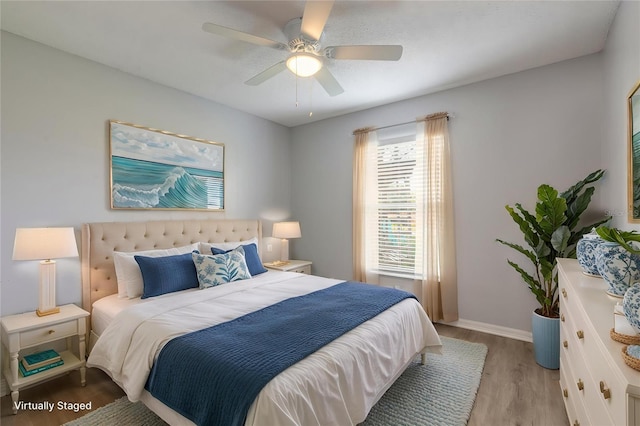 613 Clairmont Ln, South Daytona, FL 32119 - bedroom with wood finished floors, baseboards, and ceiling fan