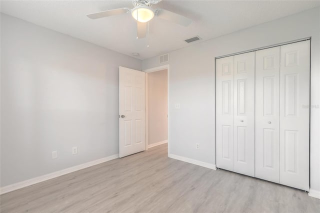 613 Clairmont Ln, South Daytona, FL 32119 - unfurnished bedroom with light wood-type flooring, baseboards, a closet, and ceiling fan