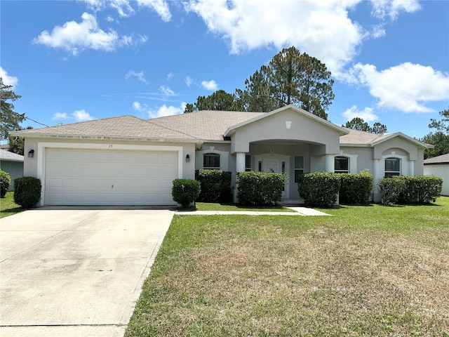 15 Ruth Dr, Palm Coast, FL 32164 - single story home featuring stucco siding, driveway, a front lawn, and an attached garage