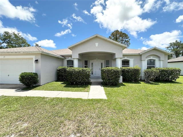 15 Ruth Dr, Palm Coast, FL 32164 - view of front of property featuring an attached garage, a front lawn, and stucco siding